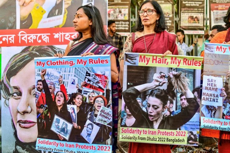 Activists display placards in support of Iranian women during a demonstration in Dhaka, Bangladesh
