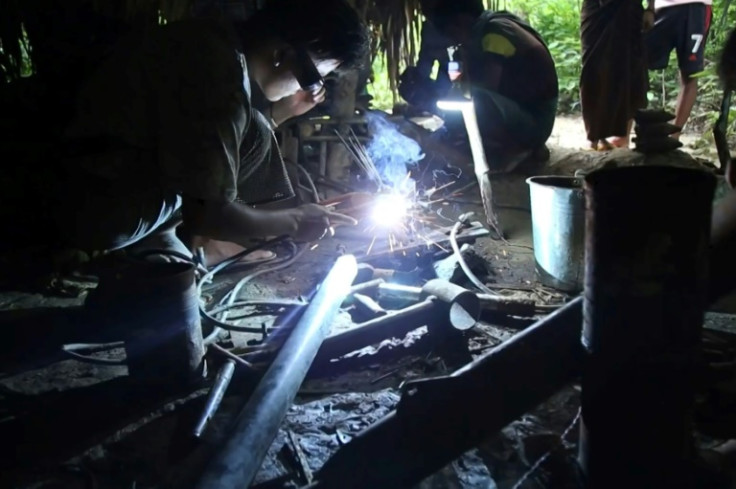 Blowtorches in hand, members of anti-junta militias sweat for hours in makeshift workshops powered by generators that are frequent targets of junta raids