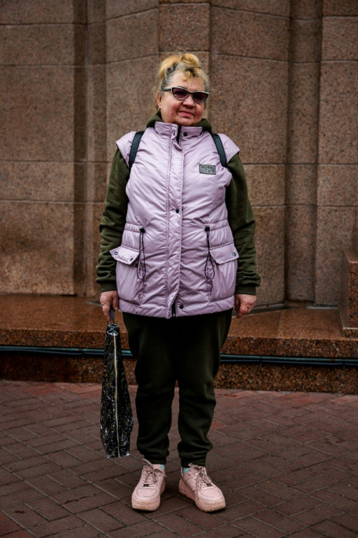 Pensioner Svitlana, 62, says khaki matches the current political climate -- though she tops her outfit off with a candy-pink down jacket