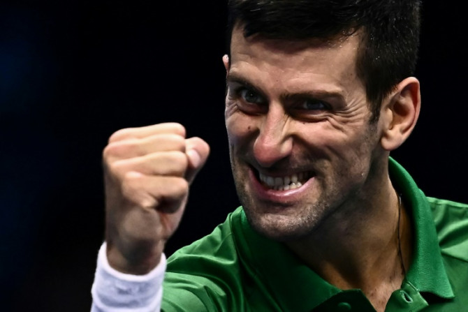 On his way: Novak Djokovic celebrates victory over Andrey Rublev to secure a last-four berth at the ATP Finals and then said he was happy he would be allowed to play in the Australian Open
