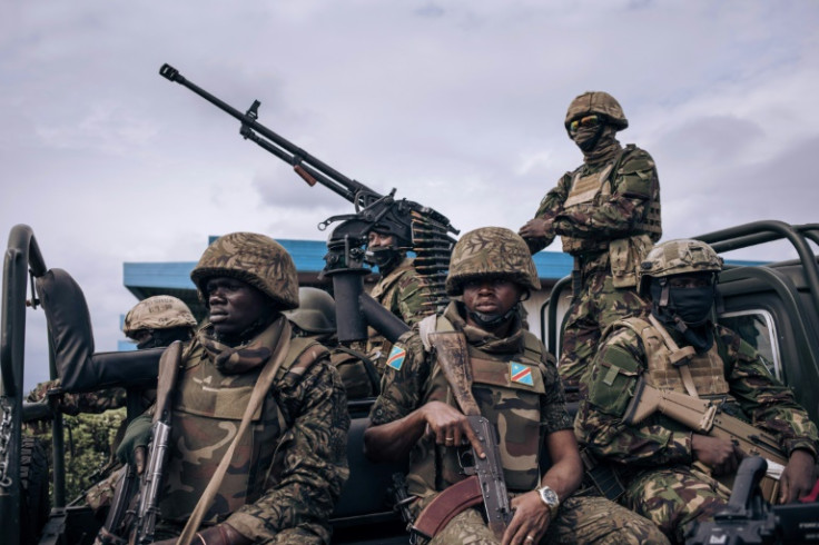 Kenyan and Congolese troops standing guard last week at Goma airport in eastern DR Congo