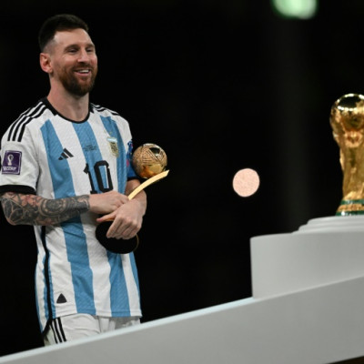 Argentina's captain Lionel Messi prepares to collect the World Cup trophy