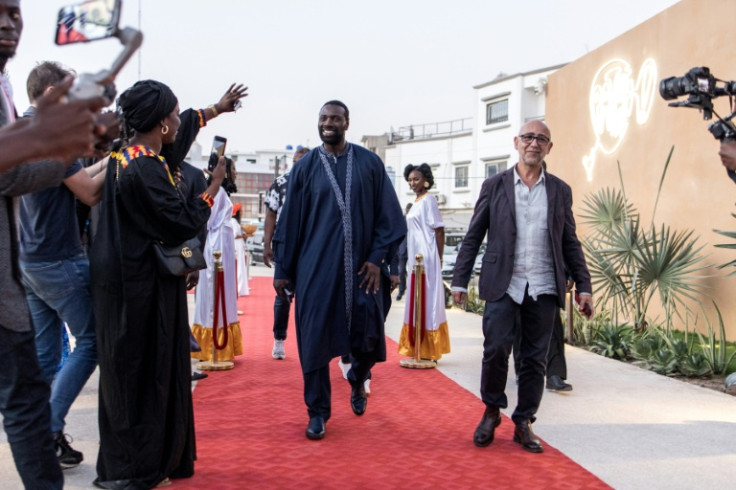 Red carpet: Omar Sy, centre, and director Mathieu Vadepied arrive for the Senegalese premiere of "Tirailleurs", entitled "Father & Soldier" in English