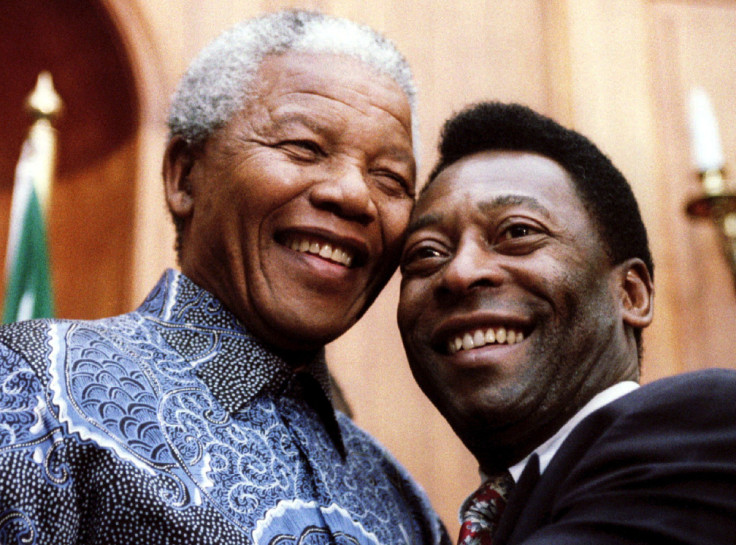 President Nelson Mandela and Brazilian soccer legend Pele smile for photographers at Union Buildings in Pretoria