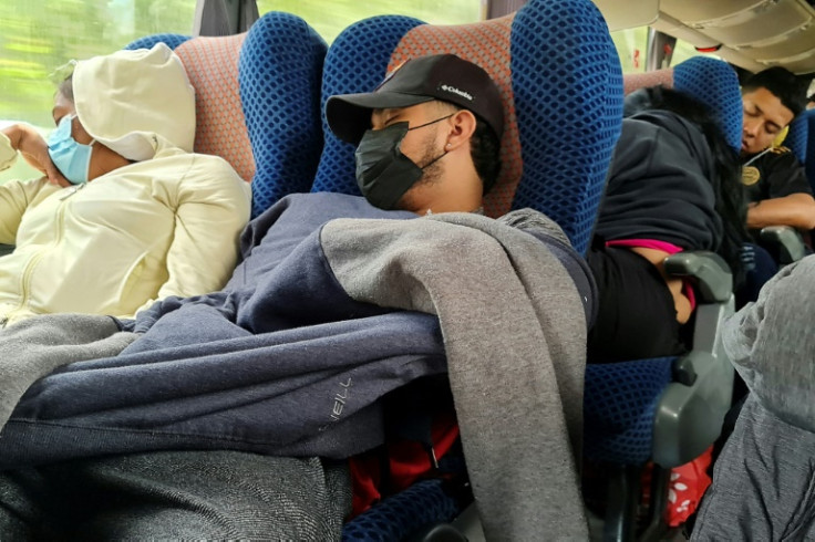 Migrants sleep during their journey from the Nicaraguan border to Guatemala in hopes of reaching the United States