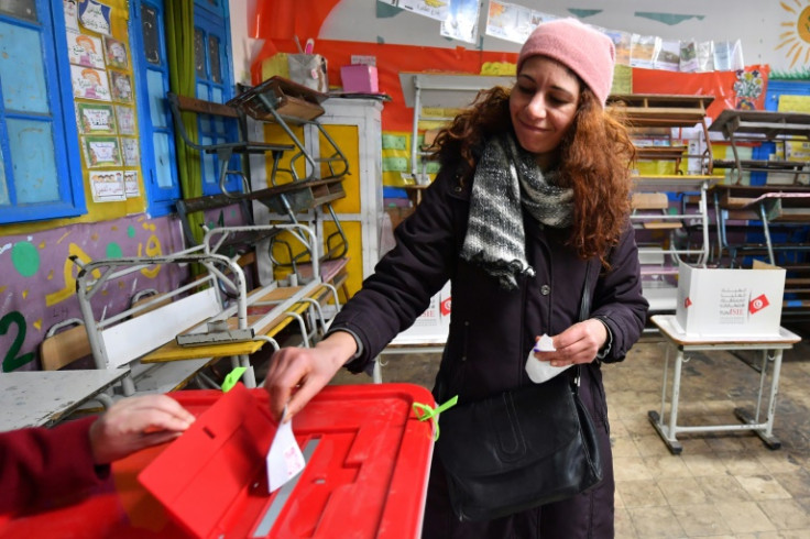 A Tunisian voter casting her ballot in the second round of parliamentary elections in January 2023 in the capital Tunis