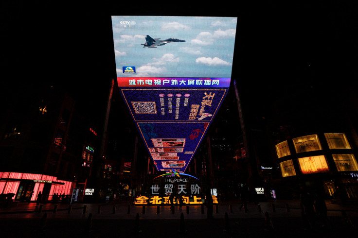 Giant screen broadcasting news footage of the Eastern Theatre Command of China's People's Liberation Army (PLA) attending a combat readiness patrols and "Joint Sword" exercises around Taiwan, in Beijing