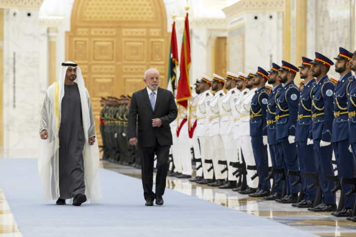 This handout image provided by the UAE's Presidential Court on April 15, 2023, shows UAE President Sheikh Mohamed bin Zayed al-Nahyan and Brazil's President Luiz Inacio Lula da Silva in Abu Dhabi