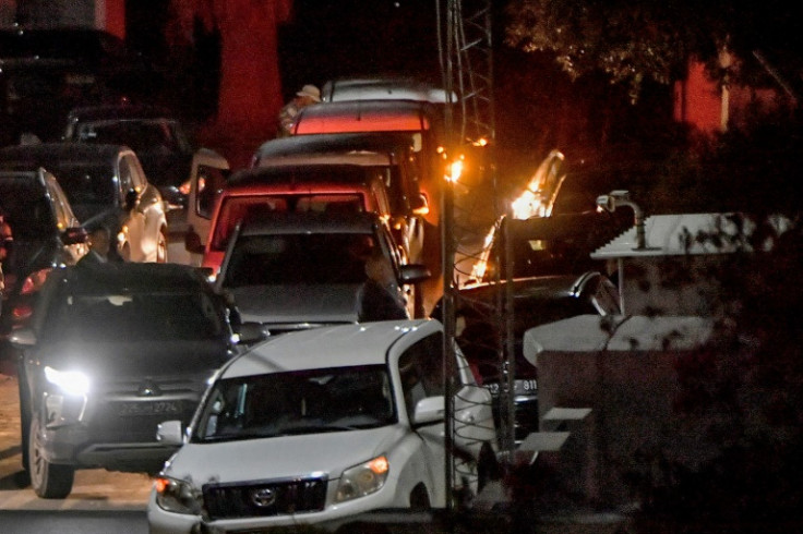 Tunisian security forces' vehicles outside the home of Rached Ghannouchi, who his Ennahdha party said was arrested