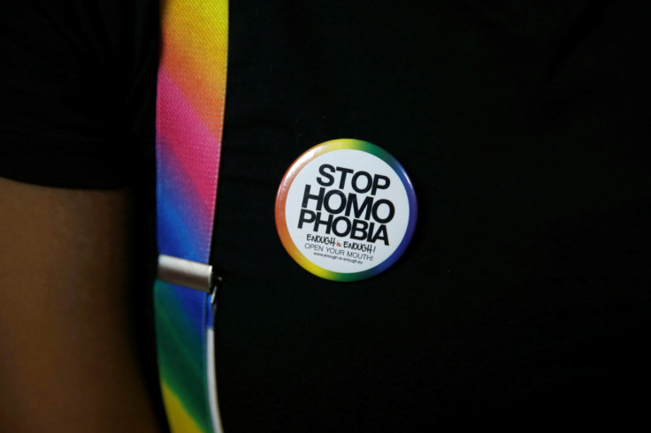 An LGBT activist wears a badge as he attends a court hearing in the Milimani high Court in Nairobi in Nairobi