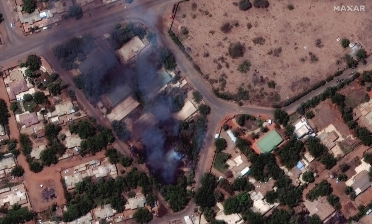 Satellite image shows burning buildings and military patrol northeast of Khartoum International Airport