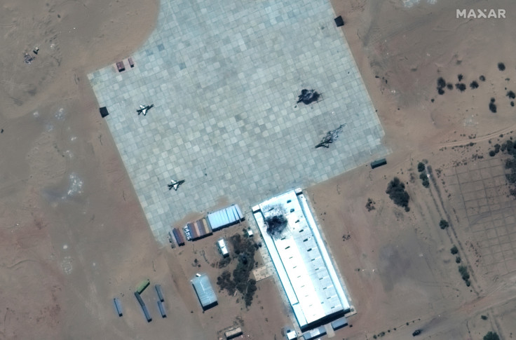 Satellite image shows destroyed FTC-2000 fighter aircraft and damaged hangar at the Merowe Airbase