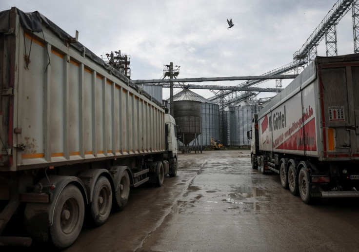 Trucks are seen at a grain storage facility in the village of Bilohiria