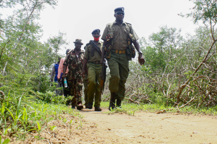 Kenya police officers patrol near the home of a suspected follower of a Christian cult in Kilifi