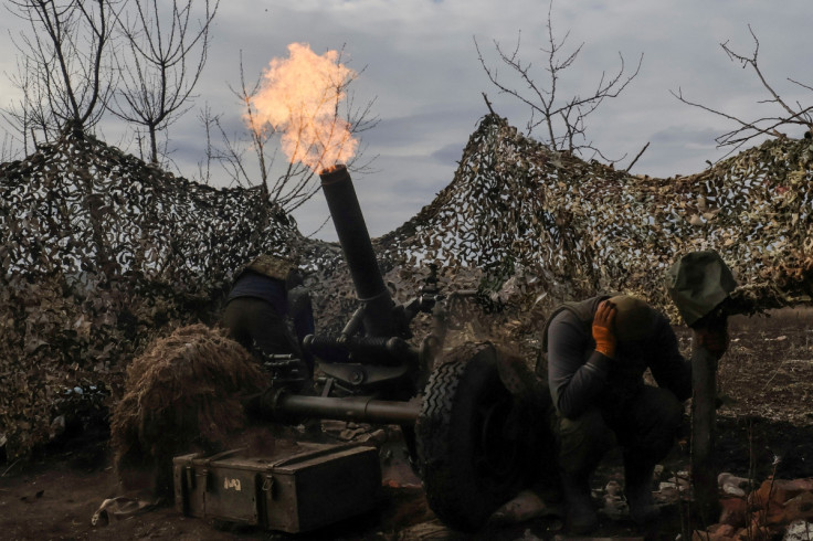 Ukrainian service members fire a mortar towards Russian troops outside the frontline town of Bakhmut