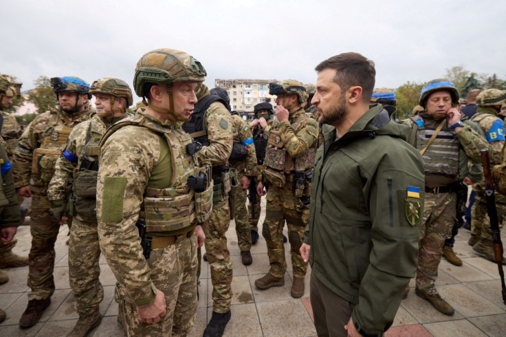 Ukraine's President Zelenskiy speaks with Commander of the Ground Forces colonel general Syrskyi in the recently liberated town of Izium