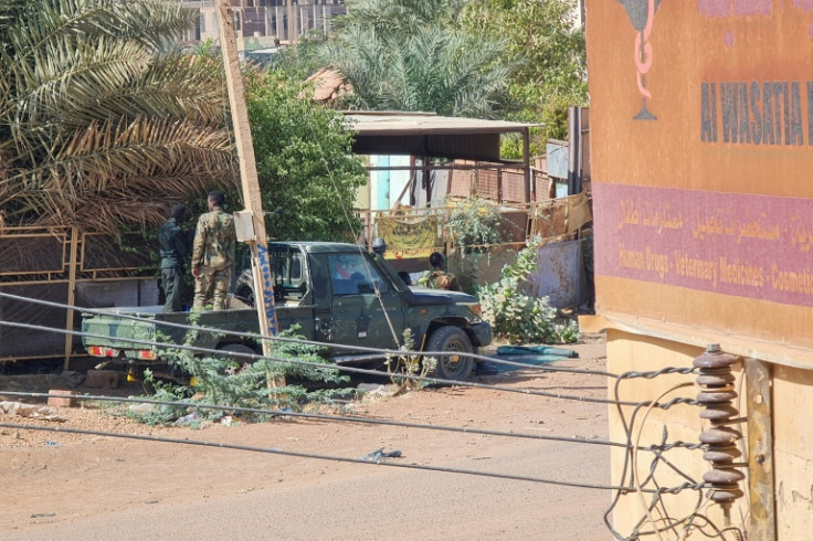 Members of security forces affiliated with the Sudanese Army man a position in the Jabra neighbourhood of Khartoum