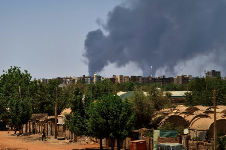 Smoke billows over Khartoum on May 1, 2023 as deadly clashes between rival generals' forces have entered their third week