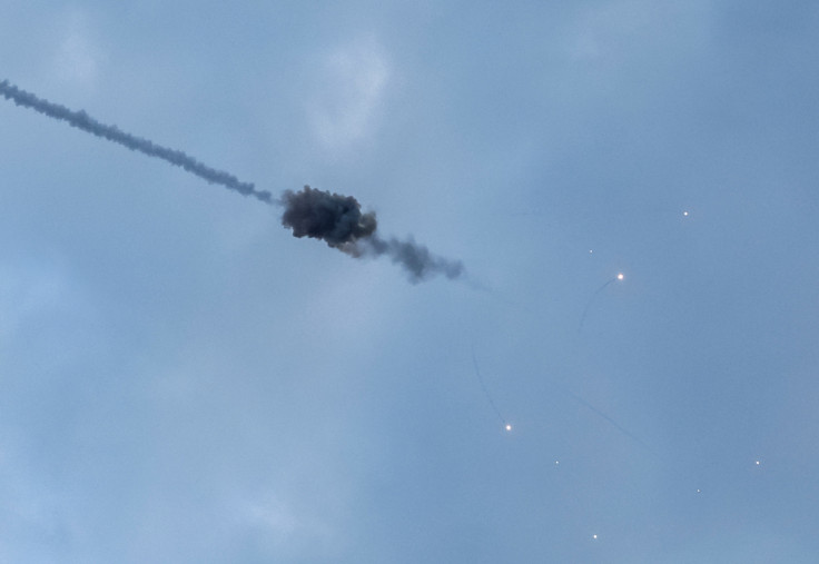 An explosion is seen in the sky over the city during a Russian missile strike in Kyiv