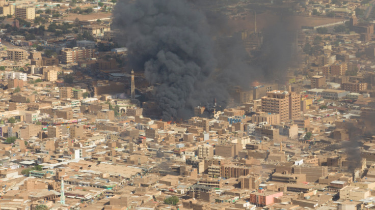 An aerial view of black smoke and fire at Omdurman market