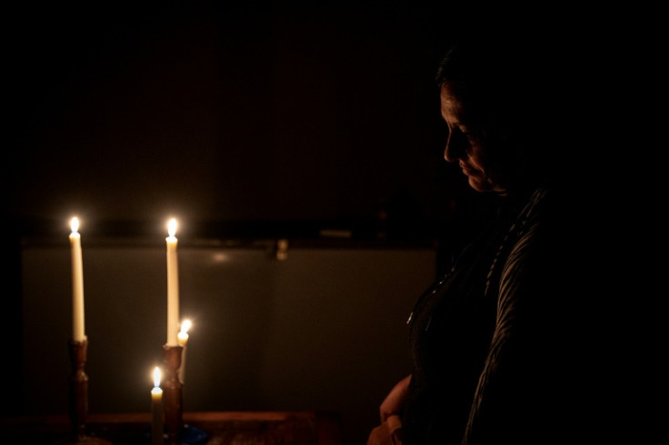 With power cuts lasting up to 12 hours per day, South Africans turn to candles for lighting
