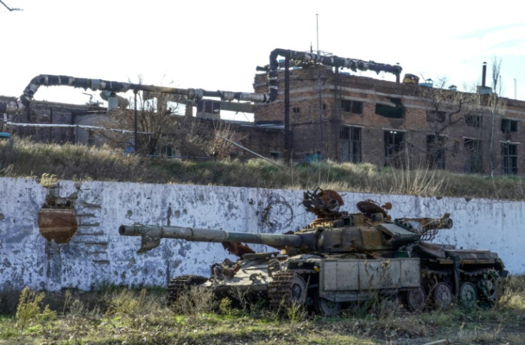 This photograph taken on November 29, 2022 shows a wrecked tank near the ruins of the Azovstal plant in the Russian-occupied Azov Sea port city of Mariupol in southeastern Ukraine