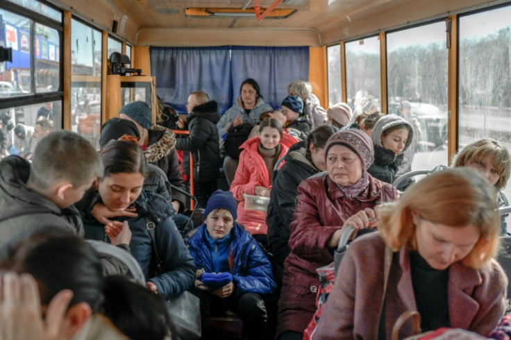 Internally displaced people arrive at a centre for the displaced persons in Zaporizhzhia, some 200 kilometres (124 miles) northwest of Mariupol on April 6, 2022