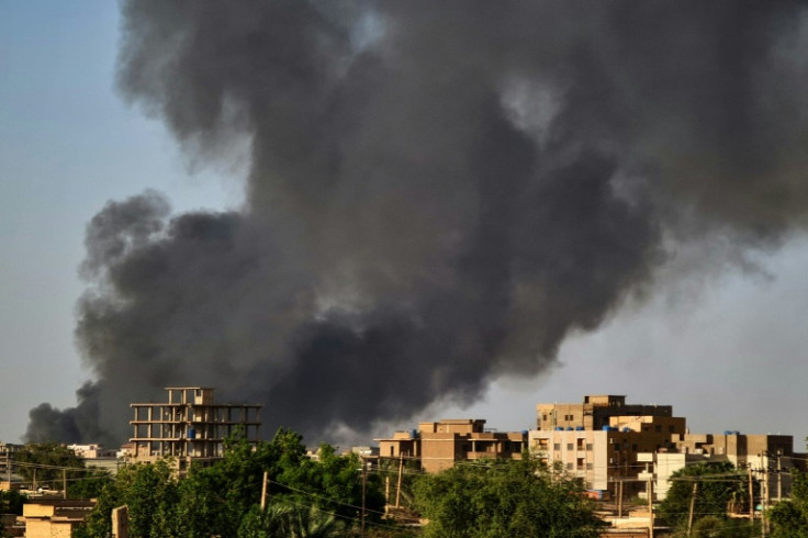Smoke rises above buildings in Khartoum during clashes between two rival generals