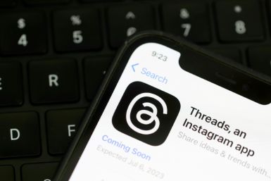 The Threads logo displayed on a cell phone in July 2023: the social media platform is now also available on the web
