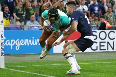 Up and over: South Africa's Kurt-Lee Arendse finishes after Manie Libbok's cross-kick