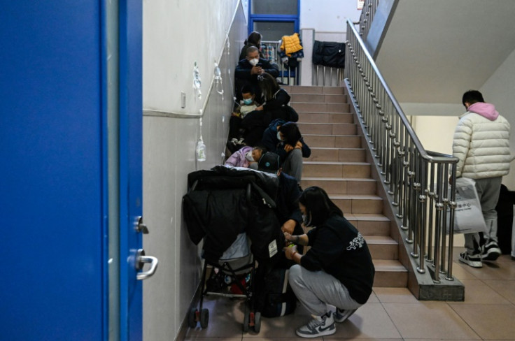 Crowds of parents and children dressed in winter clothes were seen at Beijing's Capital Institute of Pediatrics' Children's Hospital