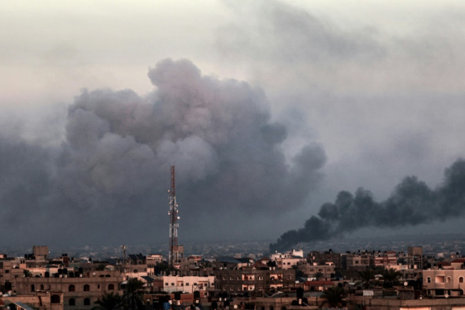 Smoke billows over Khan Yunis in the southern Gaza Strip on January 17