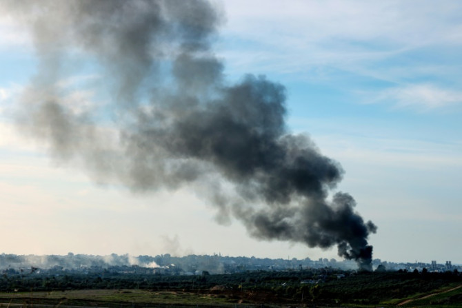 A picture taken from southern Israel on the border with Gaza shows smoke billowing over the Palestinian territory on Thursday