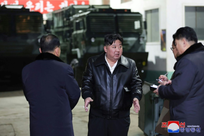 North Korean leader Kim Jong Un (C) has toured numerous weapons manufacturing facilities in recent months