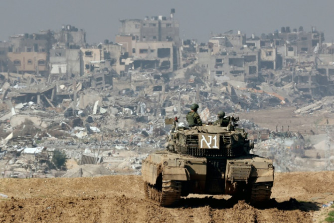 An Israeli tank is seen operating near Israel's border with Gaza