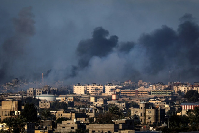 Smoke billows over buildings in Rafah