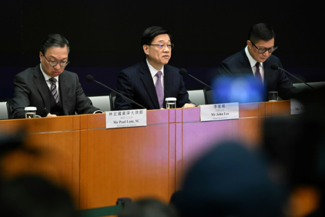 Hong Kong will create its own national security law "as soon as possible", city leader John Lee (C) said Tuesday