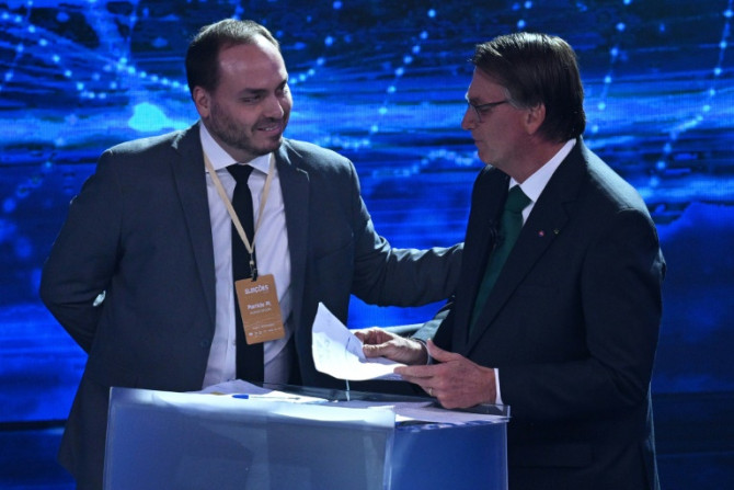 Carlos Bolsonaro (L) is under investigation regarding accusations of illegal spying that allegedy occurred during his father Jair Bolsonaro's 2019-2022 presidency