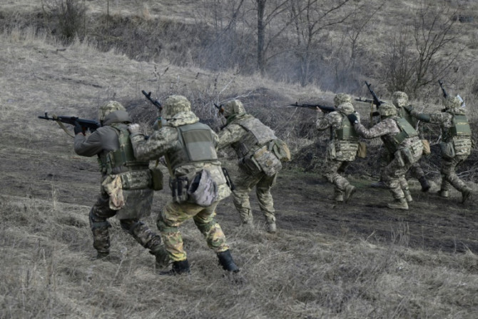 Ukrainian servicemen take part in a field exercise. The war with Russia has been going on for almost two years.