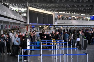 Passengers queue for rebooking at Frankfurt Airport this month after workers went on strike, forcing hundreds of flight cancellations across Germany