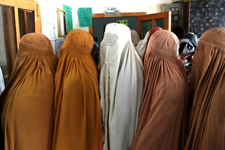 Burqa-clad women line up to cast their ballots in Pakistan's national election on Thursday