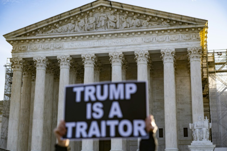Anti-Trump demonstrators outside the US Supreme Court as the court considers whether former US President Donald Trump is eligible to run for president in the 2024 election