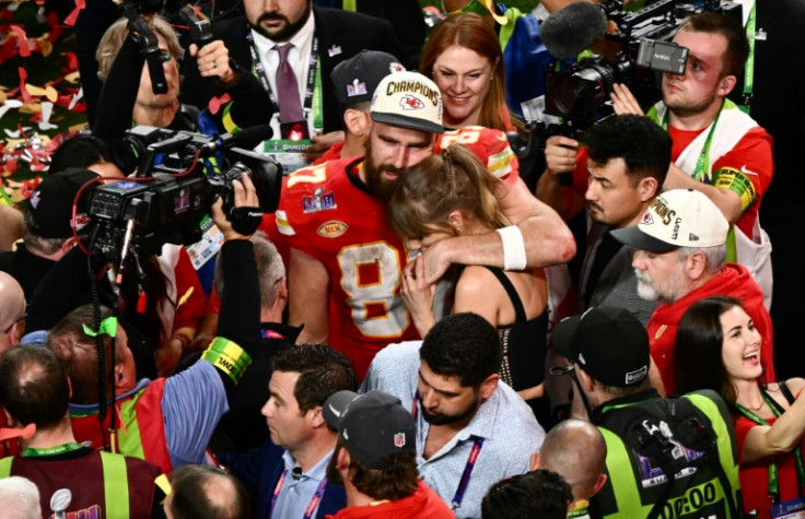 US singer-songwriter Taylor Swift and Kansas City Chiefs' tight end Travis Kelce embrace after the Chiefs' Super Bowl victory over the San Francisco 49ers