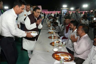 Indian tycoon Mukesh Ambani kicks off celebrations ahead of his son's wedding by feeding more than 50,000 people in his hometown