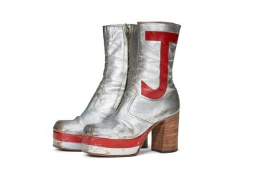 Elton John's monogrammed silver leather boots sold for nearly $100,000 at auction in New York