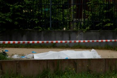 A body covered with a sheet after a double shooting in Sevran, northeast of Paris, on Sunday