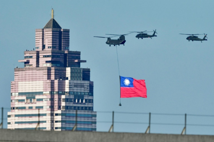 A helicopter flies Taiwan's flag during a rehearsal ahead of the May 20 inauguration ceremony of Lai Ching-te