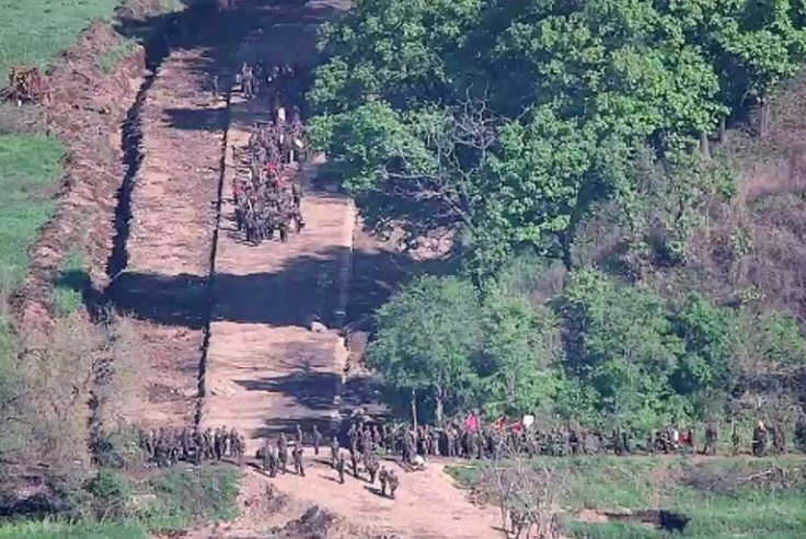 North Korean soldiers work at an undisclosed location near the heavily fortified border, as seen from a South Korean outpost