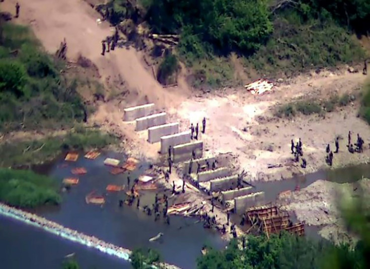 North Korean soldiers are seen working at an undisclosed location near the border in this handout photo from the South Korean military