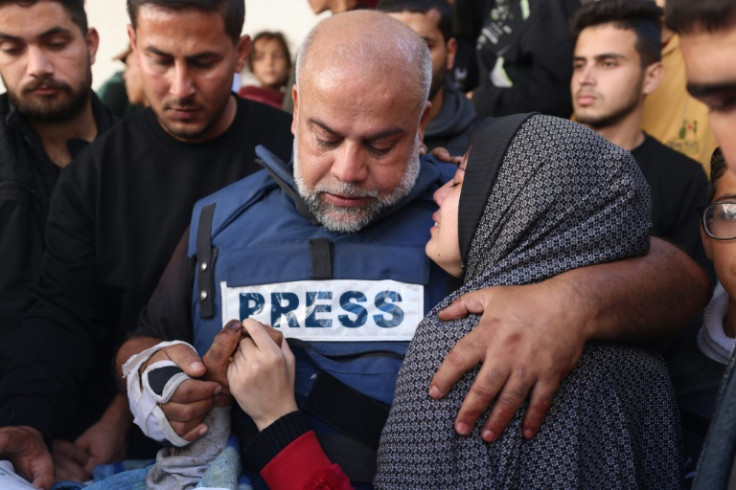 Al Jazeera's bureau chief in Gaza, Wael Al-Dahdouh (C), during the funeral of his son Hamza Wael Dahdouh, a journalist who was killed in Rafah
